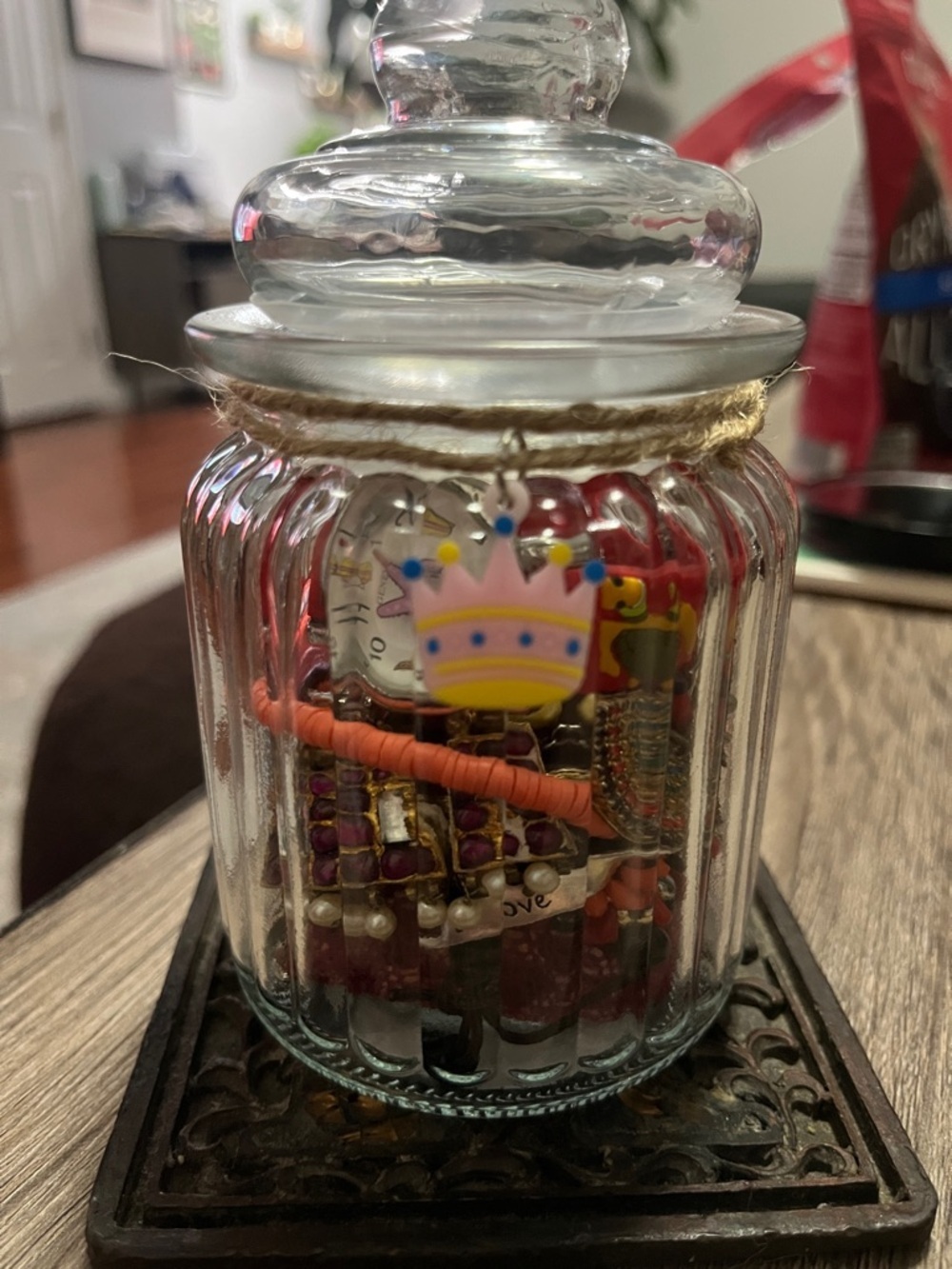Jar Filled with red tone jewelry